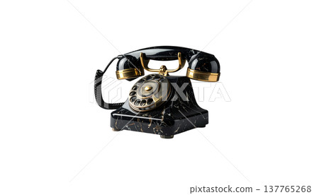 An old, vintage black retro rotary telephone sits as an object against a white background. An old, vintage black retro rotary telephone sits as an object against a white background. 137765268
