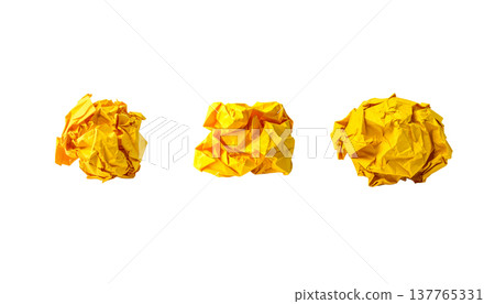 A crumpled, blank piece of paper is placed separately on a white background. 137765331