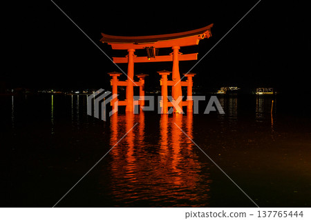 Itsukushima Shrine torii illuminated at night on Miyajima island Itsukushima Shrine torii illuminated at night on Miyajima island 137765444