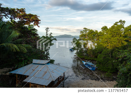 Small cove on Bunaken Island Sulawesi Indonesia under soft evening light Small cove on Bunaken Island Sulawesi Indonesia under soft evening light 137765457