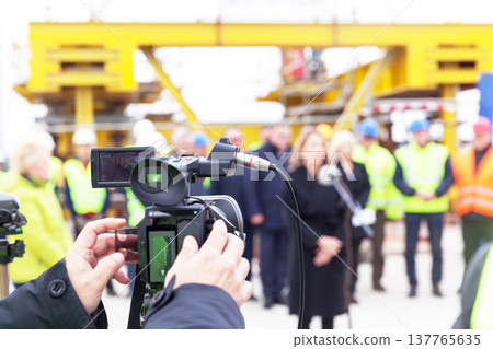 Press conference. Filming media event with a video camera. Press conference. Filming media event with a video camera. 137765635