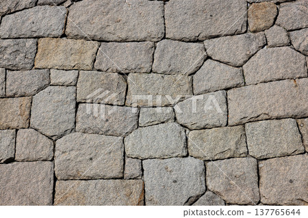 ancient stone wall pattern, stone background. ancient stone wall pattern, stone background. 137765644