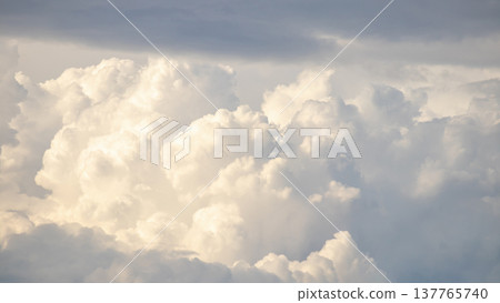 Large fluffy white cloud in the sky Large fluffy white cloud in the sky 137765740