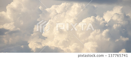 Large fluffy white cloud in the sky Large fluffy white cloud in the sky 137765741