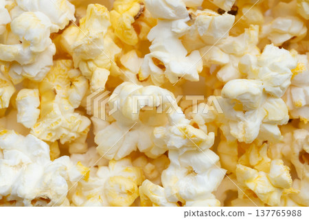 Tasty popcorn close up background top view Tasty popcorn close up background top view 137765988