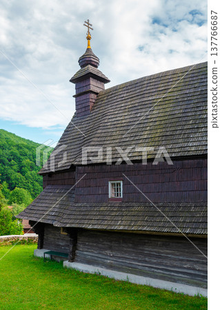 traditional wooden church architecture. likitsary, transcarpathia, ukraine - 02 jul 2020: traditional wooden church architecture. picture of an old traditional wooden church architecture. likitsary, transcarpathia, ukraine - 02 jul 2020: traditional wooden church architecture. picture of an old 137766687