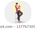 Stand-up show from man comedian standing on stage with microphone in hand, near chair and spotlight 137767305
