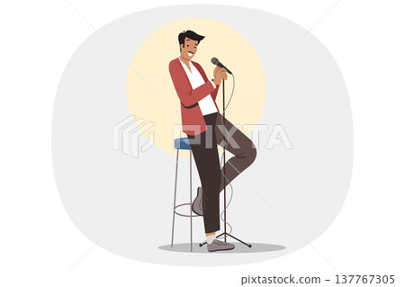 Stand-up show from man comedian standing on stage with microphone in hand, near chair and spotlight Stand-up show from man comedian standing on stage with microphone in hand, near chair and spotlight 137767305