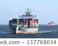 A container ship sailing through rough seas. 137768034