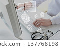 Doctors working on their computers using conversational AI 137768198