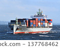 A container ship sailing through rough seas. 137768462