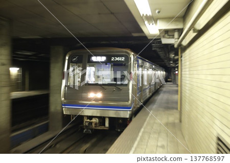 Osaka subway Yotsubashi Line train entering the station 137768597