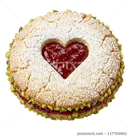 Sweet cookie filled with raspberry jam, topped with crushed pistachios and a dusting of powdered sugar, isolated 137768662