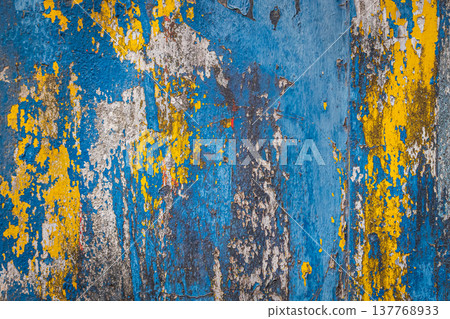 Peeling paint on the concrete wall with old cracked flaking paint. Weathered rough painted surface Peeling paint on the concrete wall with old cracked flaking paint. Weathered rough painted surface 137768933