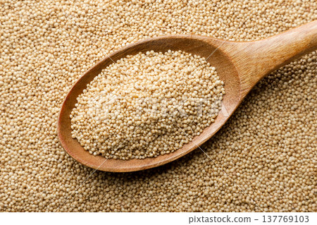 Raw amaranth grain in a wooden spoon background. Top view Raw amaranth grain in a wooden spoon background. Top view 137769103