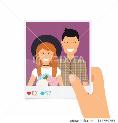 Hand holds a photo with a picture of a couple. Concept of friendship and fun with new trends and technology. Hand holds a photo with a picture of a couple. Concept of friendship and fun with new trends and technology. 137769763