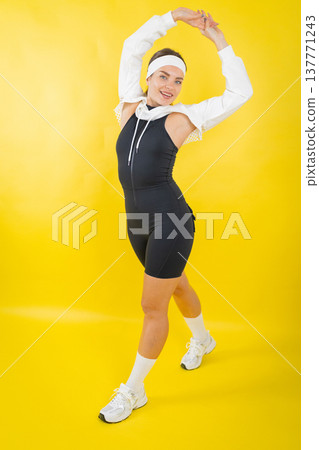 Athletic woman stretching arms, embodying active healthy lifestyle Athletic woman stretching arms, embodying active healthy lifestyle 137771243