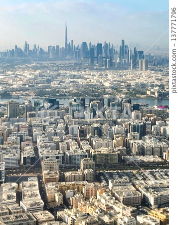 A view of the Dubai cityscape from inside the plane shortly after takeoff from Dubai Airport. A view of the Dubai cityscape from inside the plane shortly after takeoff from Dubai Airport. 137771796