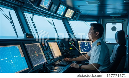 Asian naval officer operating radar navigation system on modern warship bridge with multiple digital displays and maritime control equipment Asian naval officer operating radar navigation system on modern warship bridge with multiple digital displays and maritime control equipment 137771871