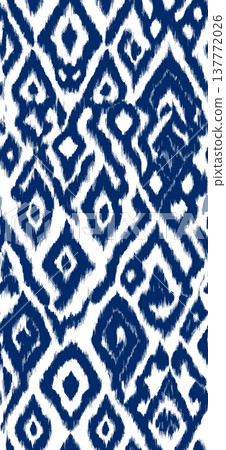 Seamless ikat geometric pattern creating textile design. Traditional blue chevron ikat pattern forming a seamless repeating background texture 137772026