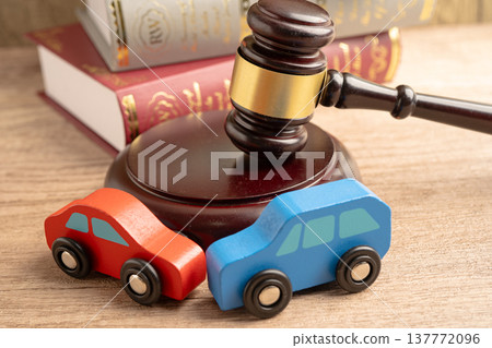 Car accident lawsuit and insurance, Judge hammer with car model. Car accident lawsuit and insurance, Judge hammer with car model. 137772096