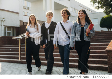 Against the stairs. Group of students are near university together Against the stairs. Group of students are near university together 137772728