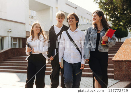 University building behind. Group of students are together 137772729