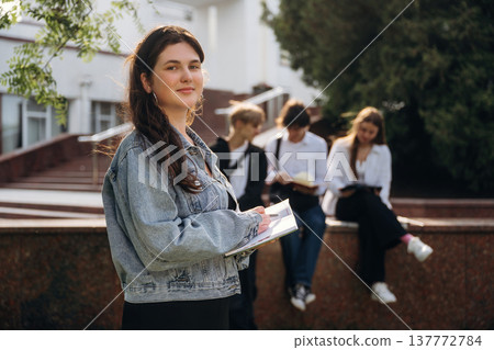 Group of students are near university together Group of students are near university together 137772784