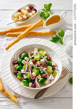 brussels sprouts salad with feta, olives in bowl brussels sprouts salad with feta, olives in bowl 137773291