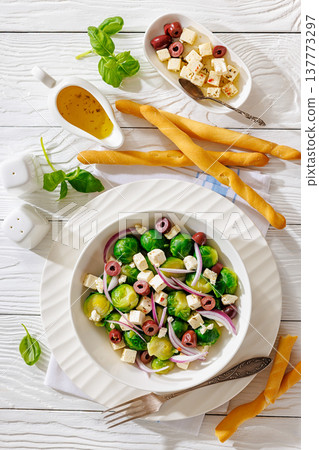 brussels sprouts salad with feta, olives in bowl brussels sprouts salad with feta, olives in bowl 137773297