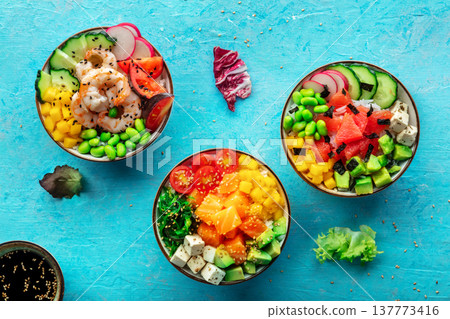 Poke bowl assortment. Rice with salmon, shrimps, and grapefruit 137773416