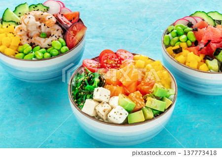 Poke bowl assortment. Rice with salmon, shrimps, and grapefruit 137773418