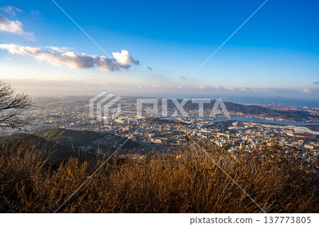 Sunset view of Kitakyushu City from the observation deck at the summit of Mt. Sarakura Sunset view of Kitakyushu City from the observation deck at the summit of Mt. Sarakura 137773805
