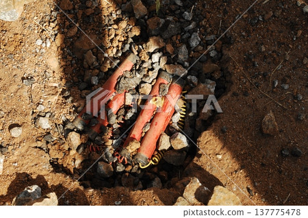 time bomb placed on a dusty mud road time bomb placed on a dusty mud road 137775478