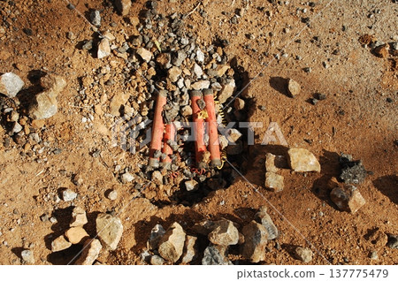 time bomb placed on a dusty mud road time bomb placed on a dusty mud road 137775479