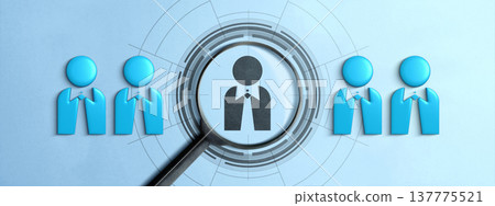 Conceptual graphic of a magnifying glass focusing on a candidate among others, representing talent search, selection, and HR vetting processes on a blue background 137775521