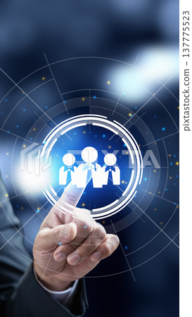 Businessman's hand interacts with a glowing digital interface showing human resources icons, representing recruitment, leadership, and team management in a futuristic corporate environment Businessman's hand interacts with a glowing digital interface showing human resources icons, representing recruitment, leadership, and team management in a futuristic corporate environment 137775523