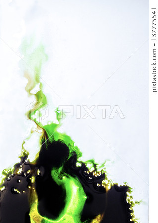 Vibrant neon green and dark black ink reacting and spreading on a white surface, creating fluid organic shapes. Perfect for abstract art, science, or creative design projects 137775541
