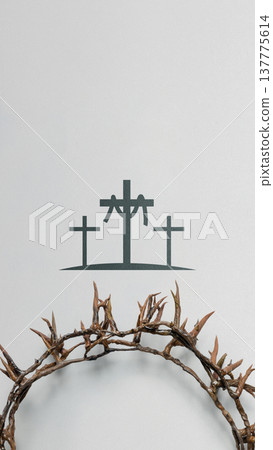 Symbolic image featuring a crown of thorns in the foreground and a silhouette of three crosses on a textured background, representing the crucifixion of Jesus Christ and Easter Symbolic image featuring a crown of thorns in the foreground and a silhouette of three crosses on a textured background, representing the crucifixion of Jesus Christ and Easter 137775614
