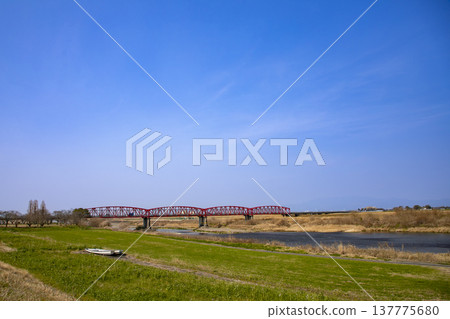 The red Chikugo River Bridge stands out against the blue sky. The red Chikugo River Bridge stands out against the blue sky. 137775680