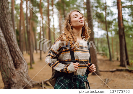 Tourist woman hiking alone in natural forest. Active lifestyle. People in forest. Nature, travel 137775793