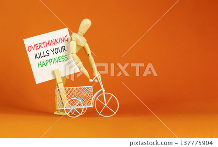 Overthinking kills your happiness symbol. Concept words Overthinking kills your happiness on white paper. Beautiful orange background. Business overthinking kills happiness concept. Copy space. 137775904