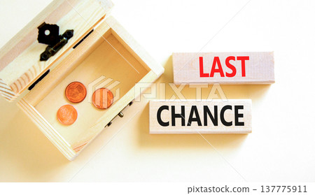 Last chance symbol. Concept word Last chance on beautiful wooden blocks. Beautiful white paper background. Beautiful wooden chest with coins. Business last chance concept. Copy space. 137775911
