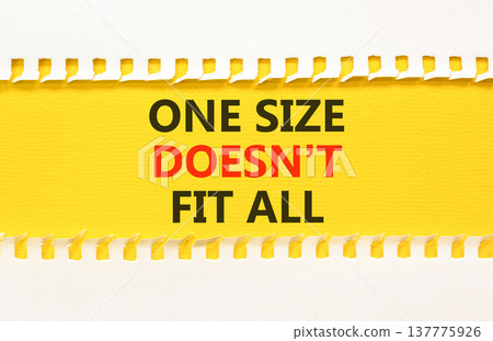 One size does not fit all symbol. Concept words One size does not fit all on beautiful yellow paper. Beautiful white paper background. Business one size does not fit all concept. Copy space. One size does not fit all symbol. Concept words One size does not fit all on beautiful yellow paper. Beautiful white paper background. Business one size does not fit all concept. Copy space. 137775926