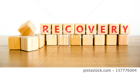 Recovery word symbol. Concept word Recovery on beautiful wooden blocks. Beautiful wooden table white background. Business medical support help recovery word concept. Copy space. 137776004