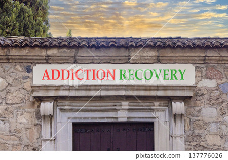 Addiction recovery symbol. Concept words Addiction recovery on beautiful big marble white sign plate. Beautiful old stone wall background. Psychology addiction recovery concept. Copy space. Addiction recovery symbol. Concept words Addiction recovery on beautiful big marble white sign plate. Beautiful old stone wall background. Psychology addiction recovery concept. Copy space. 137776026