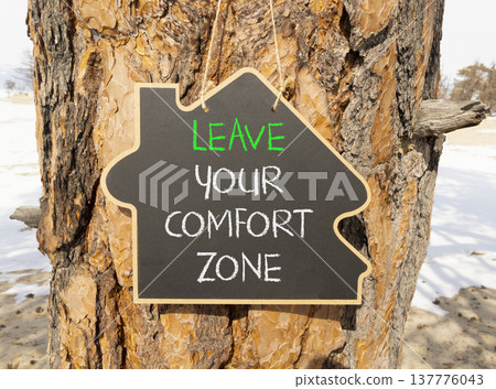 Leave your comfort zone symbol. Concept words Leave your comfort zone on beautiful black blackboard. Beautiful old tree background. Business psychological Leave your comfort zone concept. Copy space. Leave your comfort zone symbol. Concept words Leave your comfort zone on beautiful black blackboard. Beautiful old tree background. Business psychological Leave your comfort zone concept. Copy space. 137776043