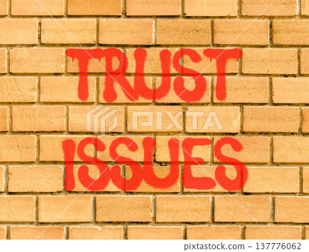 Trust issues symbol. Concept word Trust issues on beautiful brown brick wall. Beautiful brown brick wall background. Brick wall. Business trust issues concept. Copy space. Trust issues symbol. Concept word Trust issues on beautiful brown brick wall. Beautiful brown brick wall background. Brick wall. Business trust issues concept. Copy space. 137776062