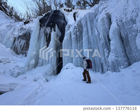 Looking up at the frozen waterfall Looking up at the frozen waterfall 137776118