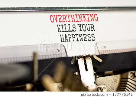 Overthinking kills your happiness symbol. Concept words Overthinking kills your happiness typed on old typewriter. Beautiful white background. Business overthinking kills happiness concept. Copy space Overthinking kills your happiness symbol. Concept words Overthinking kills your happiness typed on old typewriter. Beautiful white background. Business overthinking kills happiness concept. Copy space 137776141